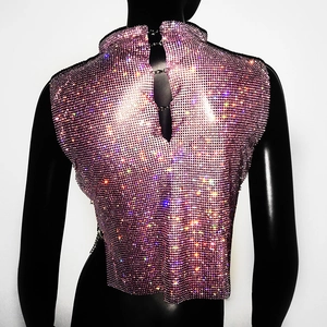 Detailed view of pink rhinestone mesh vest with stand collar and back buckle closure