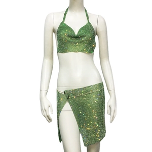 Sparkling green sequin two-piece set featuring halter crop top and side slit mini skirt