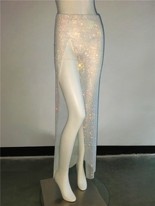 Detail of sexy high-slit mesh skirt with shimmering rhinestones and sparkling sequins