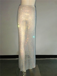Close-up of sparkling rhinestone fishnet skirt with high-density crystals and side slit