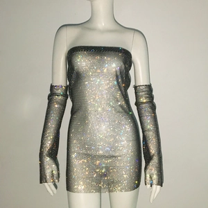 Detail of shimmering rhinestone bodycon dress with matching long sparkling arm sleeves
