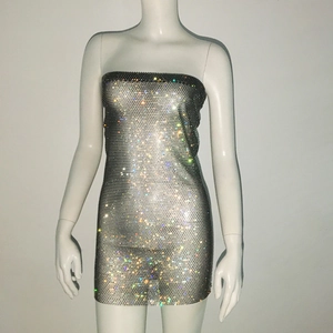 Detailed close-up of sparkling silver rhinestones on a mesh bodycon tube dress