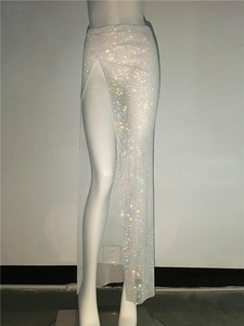 Detail of a mesh slit maxi skirt with shimmering colorful rhinestones for party wear