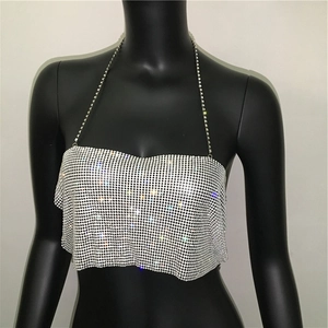 Detailed view of silver sequin halter top with sparkling rhinestones and metal mesh fabric