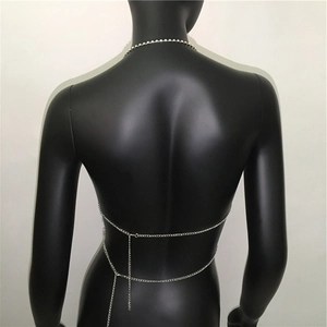 Detail of silver metallic body chain showing multi-layer design on back of mannequin