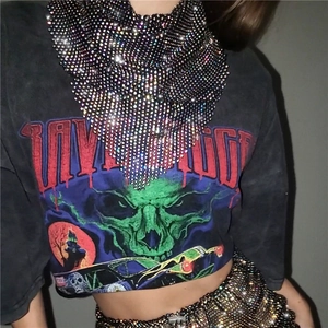 Close-up of sparkling rhinestone mesh necklace in triangle punk style for festivals