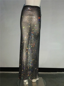 Detailed view of high-waisted black mesh maxi skirt with colorful sparkling rhinestones