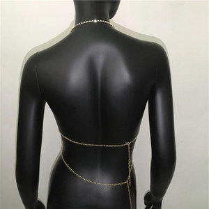 Detail of adjustable gold double-layer body chain with lobster clasp and extension chain