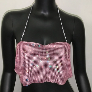Detail of pink rhinestone mesh halter top with metallic chain straps and shimmering gems