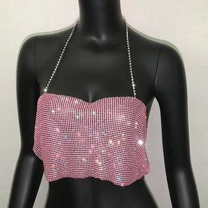 Detail of pink rhinestone halter top featuring a heart-shaped neckline and sparkling mesh