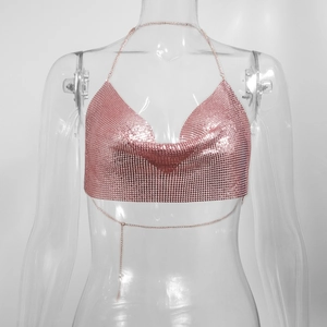 Detail of rose gold sequin halter top featuring metallic chain back and adjustable straps