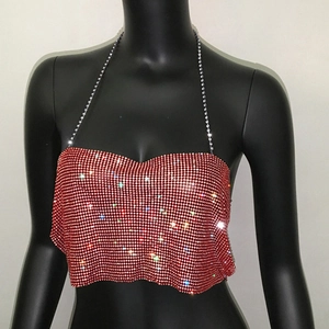 Close-up of red rhinestone halter top featuring sparkling crystals and metal chains