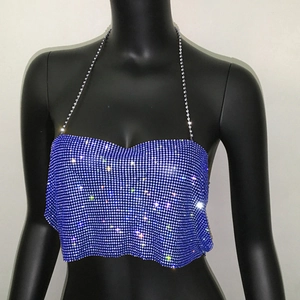 Close-up of sparkling blue rhinestone halter top with detailed sequin chain straps