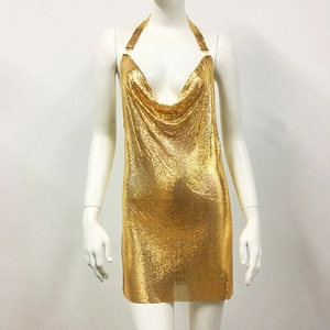 Detail of gold metal sequin halter dress with deep V-neckline and shiny chainmail mesh