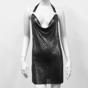 Detail view of black chainmail dress with deep cowl neck and metal halter neck strap