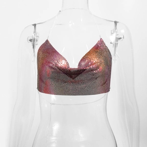Macro view of metallic red-orange gradient sequin mesh and V-neck chain detail