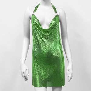 Detail of neon green metal mesh sequins on a halter neck party dress with deep V-neck