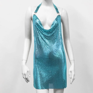 Detail of lake blue metallic sequin dress featuring a deep V-neck and halter design