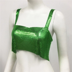 Detailed macro view of vibrant green metallic sequins on a cropped camisole top