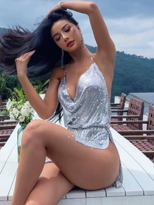 Sexy silver sequin halter dress with deep V-neck and high slit for elegant party wear