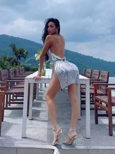 Silver sequin mini dress with backless halter neck and high side slit for party wear