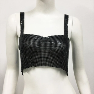 Close-up of black metallic mesh crop top showing sparkly sequins and chain straps