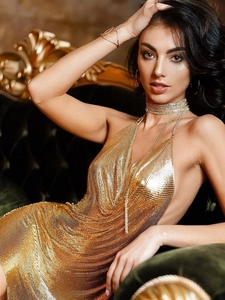 Sparkling gold metal mesh halter dress with layered necklaces for luxury party wear