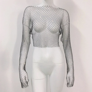 Close-up of black mesh crop top with colorful rhinestones on a white mannequin