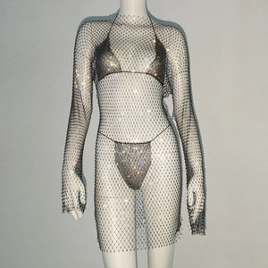 Close-up of sparkling silver rhinestone mesh dress with three-piece bikini set on a mannequin