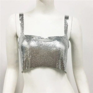 Detail of silver metallic sequin crop top showing chainmail texture and shiny reflections