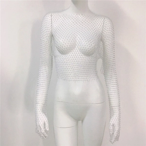 Close-up of white mesh crop top featuring sparkling rhinestones and fishtail weave