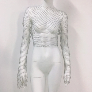 Detail of silver fishnet crop top with glittering rhinestones on fine mesh weave