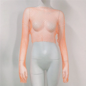 Close-up of the intricate mesh texture with vibrant orange rhinestones on a long-sleeve top