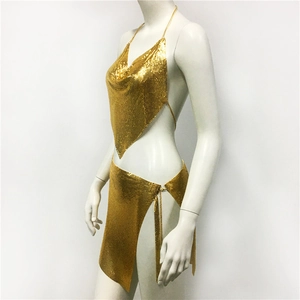 Detail of gold metal mesh two-piece set with side slit skirt and chain link textures