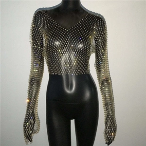 Detail of V-neck fishnet crop top featuring sparkling rhinestones and long sleeves