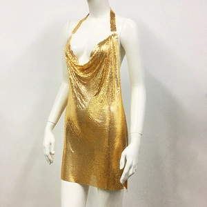 Close-up of golden metal sequin mesh dress with halter neck and draped deep V-neckline