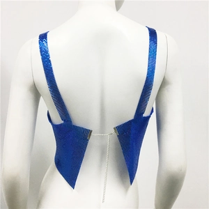 Detailed back view of a blue metal sequin halter top with crisscross silver chains