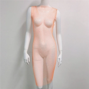 Detail of light orange fishnet dress featuring sparkling rhinestones and mesh texture