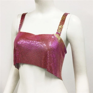 Detail shot of shimmering pink metallic sequin mesh fabric on a stylish party crop top