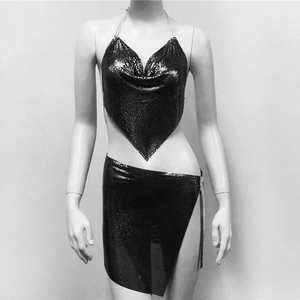Detailed macro shot of black metallic sequin mesh top and side slit mini skirt set