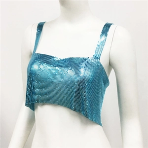 Detail of bright blue metal sequins on a cropped camisole top for party wear
