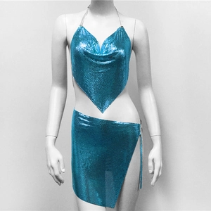 Detailed view of sparkly blue metallic sequin halter top and side slit mini skirt set