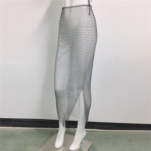 Detail of black mesh skirt with sparkling rhinestones and high-waist side slit design