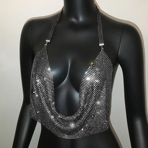 Detail of shimmering silver rhinestone halter top with V-cut on black mannequin