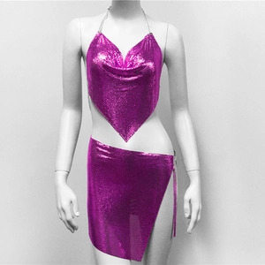 Detail view of bright magenta chainmail two-piece set with metal mesh and sequin texture