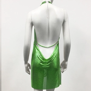 Detail of green sequin party dress featuring a backless drape and silver metal chain