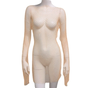 Sexy apricot fishnet rhinestone mini dress with long sleeves and shimmering crystal accents