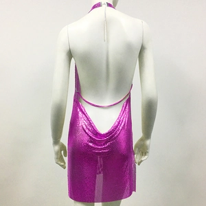 Detail of hot pink metallic sequin mesh fabric on backless halter mini dress