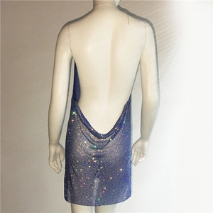 Detail view of the open-back blue sequin mini dress with delicate chain straps and glitter