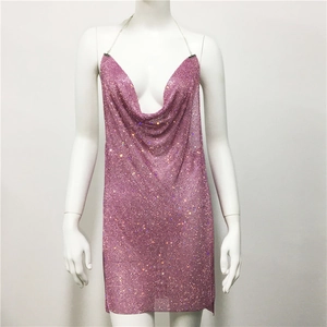 Detail of pink metal mesh sequin dress featuring a deep V-neck and halter neck design